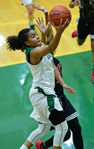 YOUNGSTOWN, OHIO - DECEMBER 20, 2017: Ursuline's Dayshanette Harris goes to the basket Shaw's Demaria Collins during the first half of their game, Tuesday night at Ursuline High School. DAVID DERMER | THE VINDICATOR