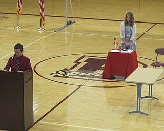 Neighbors | Zack Shively.Students Daniel Chiaberta and Ava Valko performed the White Table Ceremony to commemorate the fallen, missing and imprisoned soldiers. Valko set the table while Chiaberta explained the symbolism behind each object.
