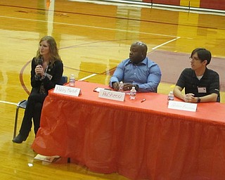 Neighbors | Zack Shively.Cardinal Mooney High School's Alumni Relations Committee coordinated the event with help from the school's guidance office. The groups brought in a variety of fields to the school. Pictured are, from left, Ashley Martof of the Youngstown Business Incubator, YSU's Network Administrator Hasheen Wilson and Patrick Bollinger, a Hybrid and Electric Vehicle Engineer at Delphi Automotive.
