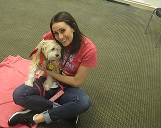 Neighbors | Zack Shively.Angela Alexandrides contacted the library about setting up the event two years ago. Since then, the event has occured monthly. Alexandrides, a teacher at Canfield, said reading to therapy dogs encourages children to read more often and with more confidence.