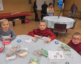Neighbors | Zack Shively.Children did crafts at the Supper with Santa event at Boardman Park. Pictured are Ella, Lucas and Ryan Huling making a craft.