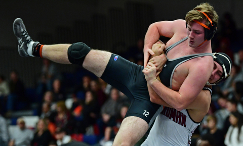 AUSTINTOWN, OHIO - DECEMBER 21, 2017: Howland's Ray Kaso is taken down to the mat by Boardman's Michael O'Horo during their 170lb bout, Thursday night at Austintown Fitch High School. DAVID DERMER | THE VINDICATOR