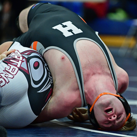 AUSTINTOWN, OHIO - DECEMBER 21, 2017: Howland's Ray Kaso attempt sot keep his shoulders off the mat while being controlled by Boardman's Michael O'Horo during their 170lb bout, Thursday night at Austintown Fitch High School. DAVID DERMER | THE VINDICATOR