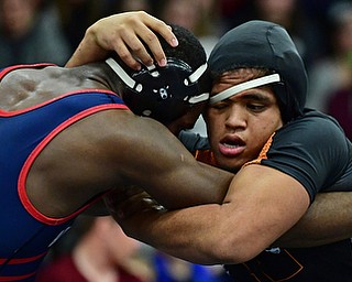 AUSTINTOWN, OHIO - DECEMBER 21, 2017: Howland's Brandon Matlock, right, grapples with Fitch's Breylon Douglas during their 220lb bout, Thursday night at Austintown Fitch High School. DAVID DERMER | THE VINDICATOR