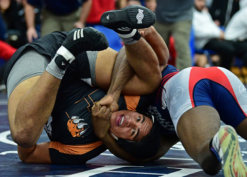 AUSTINTOWN, OHIO - DECEMBER 21, 2017: Howland's Brandon Matlock looks to break free from the control of Fitch's Breylon Douglas during their 220lb bout, Thursday night at Austintown Fitch High School. DAVID DERMER | THE VINDICATOR