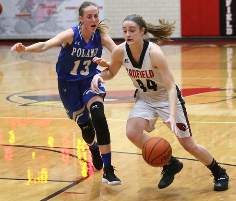 Canfield guard Grace Mangapora (44) drives towards the net against Poland forward Maggie Sebest (13) in the first quarter of an AAC high school basketball game, Friday, Dec. 23, 2017, in Canfield. Canfield won 45-34...(Nikos Frazier | The Vindicator)
