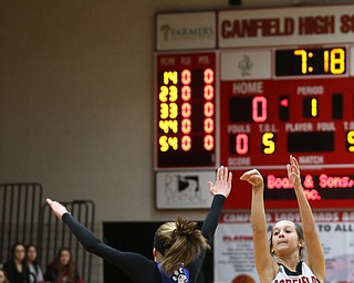 Canfield guard Ashley Veneroso (23) goes up for three  as Poland guard Bella Gajdos (0) attempts to block her shot in the first quarter of an AAC high school basketball game, Friday, Dec. 23, 2017, in Canfield. Canfield won 45-34...(Nikos Frazier | The Vindicator)