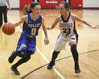 Poland guard Bella Gajdos (0) drives towards the net against Canfield guard Ashley Veneroso (23) in the third quarter of an AAC high school basketball game, Friday, Dec. 23, 2017, in Canfield. Canfield won 45-34...(Nikos Frazier | The Vindicator)
