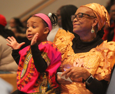 William D. Lewis  The Vindicator Janet Johnson and her grandughter Malayah Shavers, 3, both of Youngstown enjoy the first night of Kwanzaa at New Bethel Baptist Church in Youngstown 12-26-17.