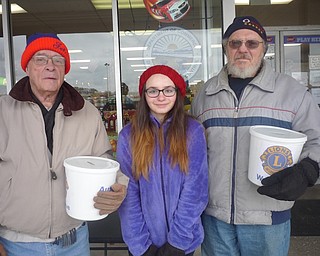 Austintown Lions Club recently received donations from patrons at the One Stop Liquor store in Austintown Plaza and from people passing by. Proceeds will benefit the work of the club in helping the sight-impaired and serving the Austintown community. Anyone interested in becoming a Lion may call Bob Whited at 330-792-7907 or email olebert1@aol.com. Above, Helena Snyder, center, helped Lions members Don Hoelzel, left, and Victor Boreio collect donations.