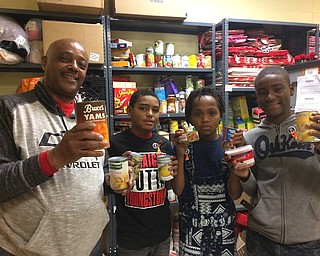 William Holmes McGuffey Elementary School collected canned goods to assemble baskets to distribute to needy families in the school. This is a project of the school’s PTO and Key Club. The teachers donate the turkeys and gift cards also are given to the families to buy potatoes and fresh produce. Staff members hope that the students learn a valuable lesson about helping others. Above from left, Terry Wilkie, WHM Elementary School PTO president, and sixth-grade students Clifton Scott, Isaiah Walker and Tiawan Clinkscale display some of the items to be donated.