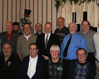 Berlin-Ellsworth Ruritan met for its annual Christmas party Dec. 11 at A La Cart Catering in Canfield. They installed officers for 2018. Lee Fowler will serve as president, Jeff Craig, vice president; Dwain VanAuker, secretary; James Gatto, sergeant-at-arms; and Denny Furman, treasurer. Doug McGlynn, Ken Bennett and Bill Porterfield will serve on the board of directors. Twelve members received awards for perfect attendance: VanAuker, 32 years; Bennett, 26; John Bates, 21; Craig, 15; Furman, 12; Fred Mayorga, seven; Joe Capasso, six; Walt Overly and Fowler, five; Gatto, two; and Brian Devine and Bill Porterfield, one year. The club welcomes anyone interested in becoming a member. Call Furman at 330-565-3365. Above, seated from left, are Tony Farelli, Porterfield, Fowler and Bennett. Standing are Mayorga, Furman, Gatto, Jay Rhinehart, Devine, Steve Reph, Craig, Overly, VanAuker and Bates.