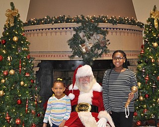 Neighbors | Submitted .Nariah Williams and Yazirah Muhammad posed for a picture with Santa Claus as they attended the Breakfast with Santa put on by Meridian HealthCare.