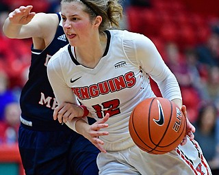 YOUNGSTOWN, OHIO - DECEMBER 28, 2017: Youngstown State's Chelsea Olson drives on Nicole Urbanick during the first half of their game on Thursday night at Beeghly Center. Youngstown State won 76-59. DAVID DERMER | THE VINDICATOR