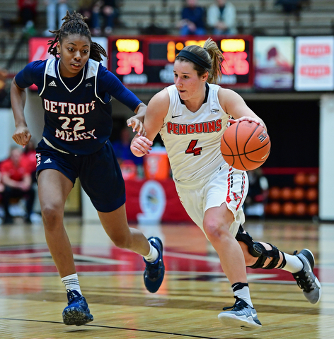 YOUNGSTOWN, OHIO - DECEMBER 28, 2017: Youngstown State's Nikki Arbanas drives on Detroit's Zoey Oatis during the first half of their game on Thursday night at Beeghly Center. Youngstown State won 76-59. DAVID DERMER | THE VINDICATOR