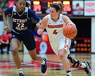 YOUNGSTOWN, OHIO - DECEMBER 28, 2017: Youngstown State's Nikki Arbanas drives on Detroit's Zoey Oatis during the first half of their game on Thursday night at Beeghly Center. Youngstown State won 76-59. DAVID DERMER | THE VINDICATOR