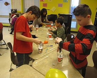 Neighbors | Zack Shively.The classes made their crafts after playing their games. Pictured, Mr. Ritter's fifth grade class made snow globes during their winter classroom party.