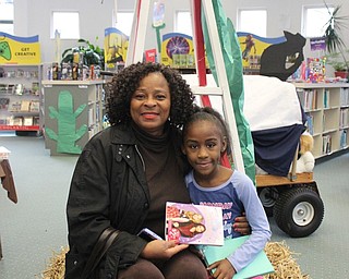 Neighbors | Abby Slanker.A C.H. Campbell Elementary School second-grade student browsed the book fair with her grandmother during the school’s annual Grandparents Day on Nov. 15.