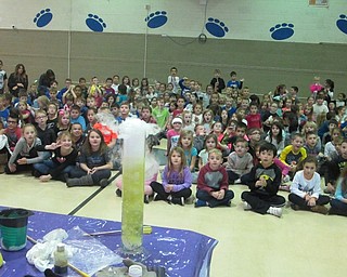 Neighbors | Zack Shively.Mad Science's "Fire and Ice" assembly centered around some experiments using fire and many using dry ice. Pictured, Union Elementary first and second graders react to a chemical reaction combining dry ice and a tube of liquid. The reaction, dubbed the "rainbow reaction," changed the colors of the liquid in the container.