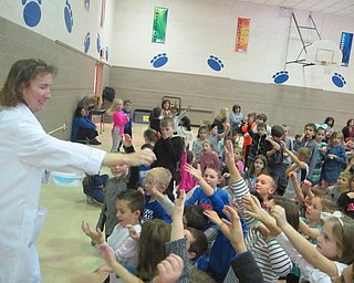 Neighbors | Zack Shively.Marcia Dilling created a reaction using dry ice, which resulted in a bubbles. Dilling, under her mad scientist name "Dr. M," tossed the bubbles to the students.