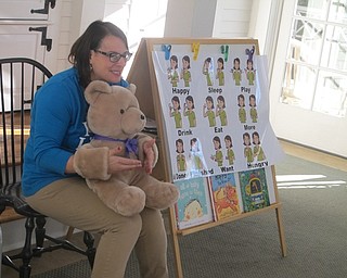Neighbors | Zack Shively.Poland librarian Karen Steed used a teddy bear to help her teach American Sign Language during the library's "ASL Baby Brilliant: Bonding with Babies and Books and Signs, Oh My!" event on Nov. 29.