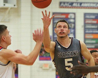 William D. Lewis The Vindicator  Boardman's Mike Melewski(5) shoots past Fitch's Blake Baker(3) during 12-29-17 action at Fitch.