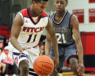 William D. Lewis The Vindicator  Fitch'sEmanuel Dawkins(11) drives around Boardman's Che Trevena(21) during 12-29-17 action at Fitch.