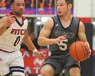 William D. Lewis The Vindicator Boardman's Mike Melewski(5) keeps the ball from Fitch's Randy Smith(0) during 12-29-17 action at Fitch.