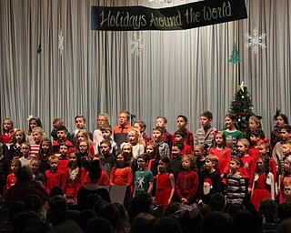 Neighbors | Abby Slanker.Hilltop Elementary School second-grade students performed the school’s annual Holidays Around the World program under the direction of Hilltop music director Stephanie Summers on Dec. 19.