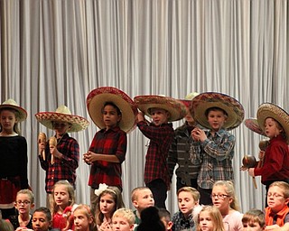 Neighbors | Abby Slanker.Hilltop Elementary School second-grade students donned sombreros during the singing of “The Pinata Song” at the school’s annual Holidays Around the World program on Dec. 19.