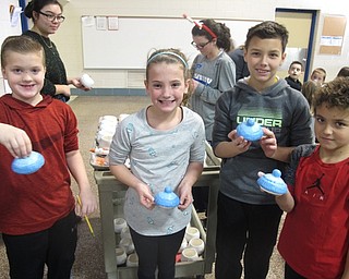 Neighbors | Zack Shively.The fourth grade had done the project in the past, but this year principal Michael Daley expanded the project to all studnets at Dobbins Elementary. Pictured are from left, fourth grade students Aidyn Vranches, Julia Snyder, Jacob O'Bruba and Anthony Richmond.