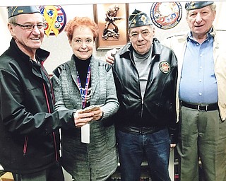 Catholic War Veterans Post 1292 recently sponsored a reverse raffle and basket auction to benefit veterans and their families. In total, $2,000 was raised. Above, from left, are Gary Burns, post commander; Lori Stone, volunteer; Al Bisker, post trustee; and John Fromel, first vice officer.