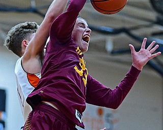 NEW MIDDLETOWN, OHIO - DECEMBER 29, 2017: South Range's Brady White fight to secure the ball away from Springfield's Evan Ohlin during the first half of their game on Friday night at Springfield High School. DAVID DERMER | THE VINDICATOR