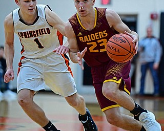 NEW MIDDLETOWN, OHIO - DECEMBER 29, 2017: South Range's Jaxon Anderson looks to pass while driving on Springfield's Evan Ohlin during the second half of their game on Friday night at Springfield High School. DAVID DERMER | THE VINDICATOR