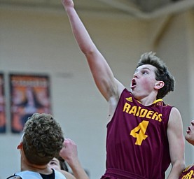 NEW MIDDLETOWN, OHIO - DECEMBER 29, 2017: South Range's Brennan Toy goes to the basket over Springfield's Evan Ohlin during the second half of their game on Friday night at Springfield High School. DAVID DERMER | THE VINDICATOR