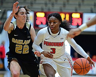 YOUNGSTOWN, OHIO - DECEMBER 30, 2017: Youngstown State's Indiya Benjamin drives on Oakland's Taylor Gleason during the second half of their game on Saturday afternoon at Beegley Center. Oakland won 58-48. DAVID DERMER | THE VINDICATOR