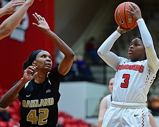 YOUNGSTOWN, OHIO - DECEMBER 30, 2017: Youngstown State's Indiya Benjamin shoots over Oakland's Mercy Agwaniru during the second half of their game on Saturday afternoon at Beegley Center. Oakland won 58-48. DAVID DERMER | THE VINDICATOR