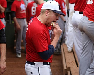 Trumbull County player Ryan Lee(18)(JFK) enjoys a taco during the 6th inning in the 2017 High School Valley All Star Classic, Friday, June 9, 2017 at Eastwood Field. Coach Don Lee bought the team tacos in celebration after their first of 8 runs. Trumbull County won 8-6. ..(Nikos Frazier | The Vindicator)..
