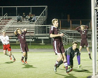 /c23/ scores a goal past Boardman goalie Jeffrey Holmes (5) during the second half as Boardman High School takes on Canfield High School, Wednesday, Oct. 18, 2017, at Canfield High School in Canfield. Boardman's Sean Buck (27) shows his frustration in the background...(Nikos Frazier | The Vindicator)..