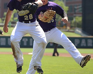 Champion Golden Flashes pitcher Andrew Russel (28) and Champion Golden Flashes first baseman AJ Meyer (25) celebrate the third out in the sixth inning as Champion takes on Berlin Hiland in the DIII baseball championship, Saturday, June 3, 2017 at Huntington Park in Columbus. Champion won 1-0...(Nikos Frazier | The Vindicator)