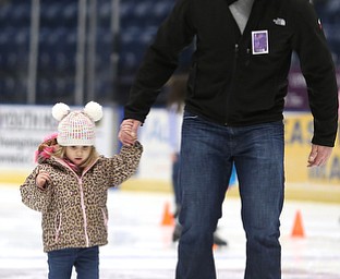 Dustin Rivera of Girard helps his daughter, Camille(3) skate during First Night Youngstown, Sunday, Dec. 31, 2017, at the Covelli Centre in Youngstown. ..(Nikos Frazier | The Vindicator)