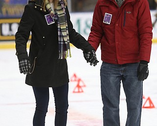 Tyler Hostefler and Megan Schneider hold hands as they ice skate during First Night Youngstown, Sunday, Dec. 31, 2017, at LOCATION in Youngstown. ..(Nikos Frazier | The Vindicator)