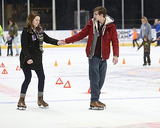 Tyler Hostefler and Megan Schneider hold hands as they ice skate during First Night Youngstown, Sunday, Dec. 31, 2017, at LOCATION in Youngstown. ..(Nikos Frazier | The Vindicator)