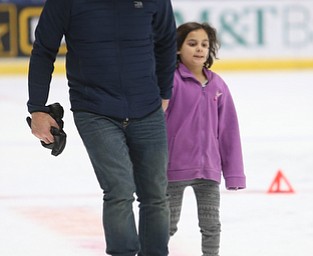 Tony DiStefano of Boardman holds hands with his daughter, Simona(7) as they ice skate during First Night Youngstown, Sunday, Dec. 31, 2017, at LOCATION in Youngstown. ..(Nikos Frazier | The Vindicator)