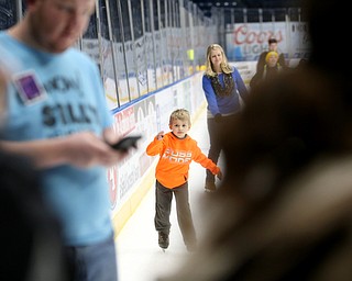 Geffery Lafleme(6) of Salem ice skates in front of his sister, Jessica Valsi(blue) during First Night Youngstown, Sunday, Dec. 31, 2017, at LOCATION in Youngstown. ..(Nikos Frazier | The Vindicator)