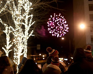 People watch the fireworks display during First Night Youngstown, Sunday, Dec. 31, 2017, in downtown Youngstown. ..(Nikos Frazier | The Vindicator)