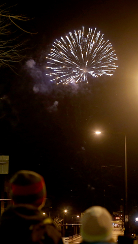 People watch the fireworks display during First Night Youngstown, Sunday, Dec. 31, 2017, in downtown Youngstown. ..(Nikos Frazier | The Vindicator)