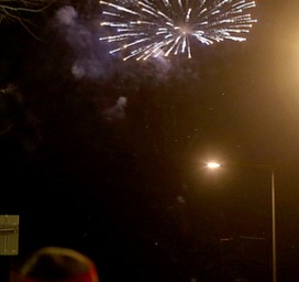 People watch the fireworks display during First Night Youngstown, Sunday, Dec. 31, 2017, in downtown Youngstown. ..(Nikos Frazier | The Vindicator)