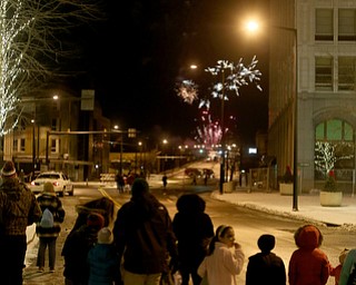 People watch the fireworks display during First Night Youngstown, Sunday, Dec. 31, 2017, in downtown Youngstown. ..(Nikos Frazier | The Vindicator)