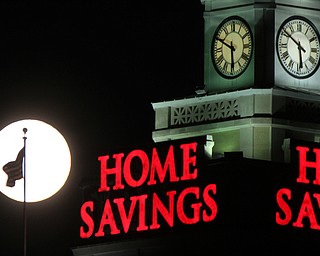 William D. Lewis the Vindicator A super moon rises over the Home Savings clock tower in downtown in Youngsotwn Monday Jan 1 2018. This super moon is known as the Wolf moon.